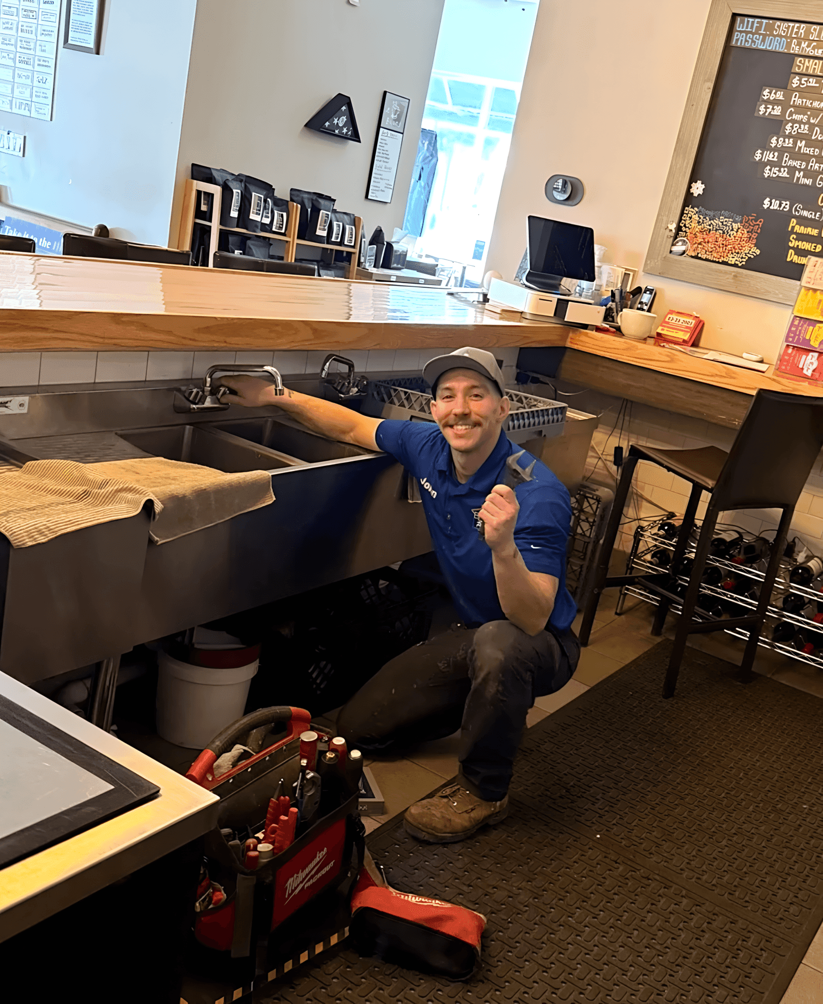 John of Barr Web Plumbing on the job, installing a sink and fixtures